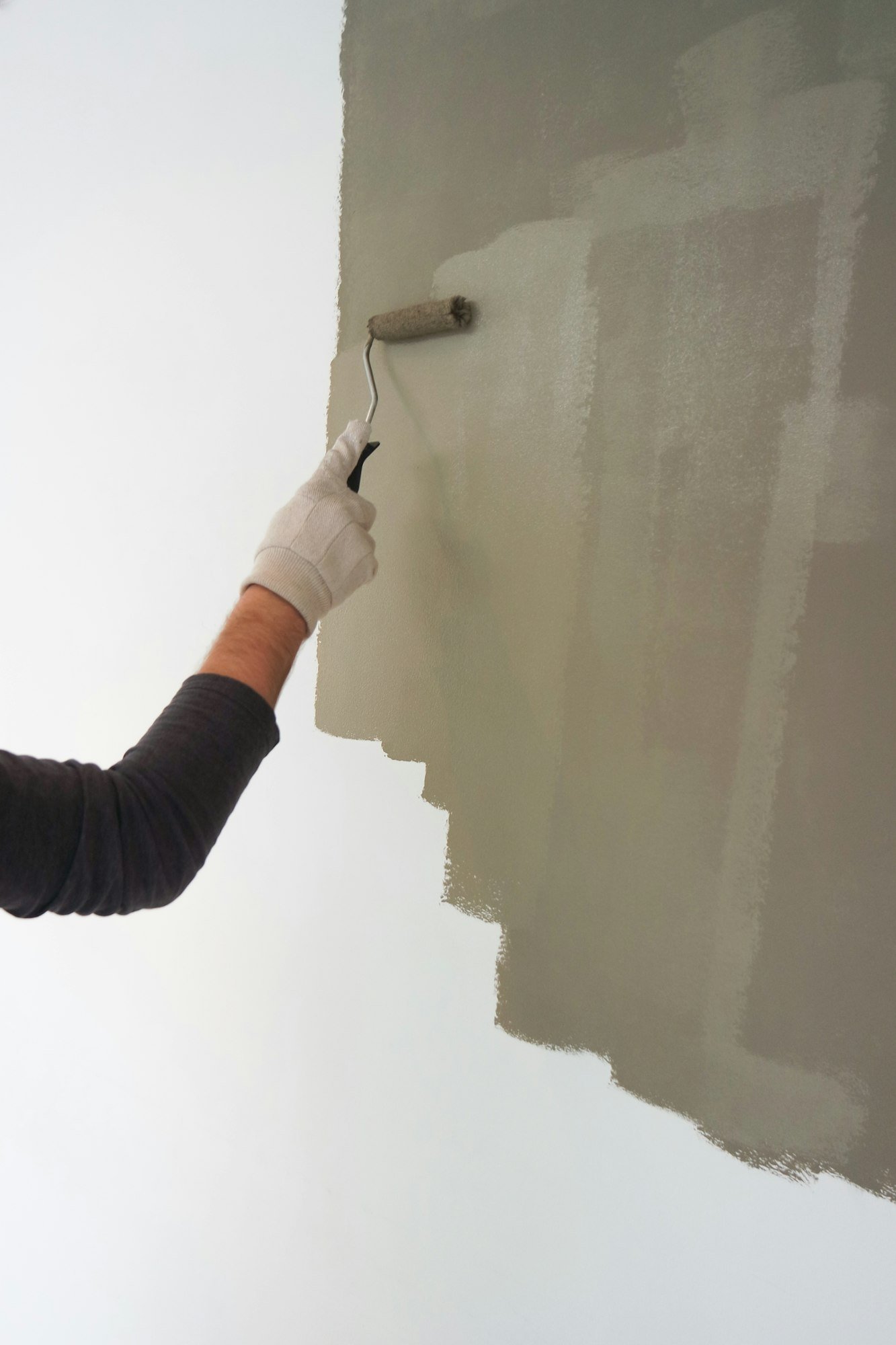 Man renovating / painting the walls.